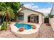 Inviting pool and spa with decorative pots, surrounded by lush greenery and a patio, perfect for outdoor relaxation at 4738 N Greenview W Cir, Litchfield Park, AZ 85340