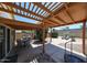 Inviting backyard featuring a covered patio, barbecue area, and comfortable lounge seating for relaxation at 4765 E Charleston Ave, Phoenix, AZ 85032