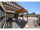 Charming backyard with a covered patio, desert landscaping, and ample space for outdoor activities at 4765 E Charleston Ave, Phoenix, AZ 85032