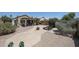 Expansive backyard featuring a covered patio, fire pit, and desert landscaping, ideal for entertaining at 4765 E Charleston Ave, Phoenix, AZ 85032