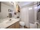 Bathroom featuring a single sink vanity and a shower/tub combo at 4765 E Charleston Ave, Phoenix, AZ 85032