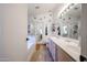 Bright bathroom with double vanity, soaking tub and glass shower at 4765 E Charleston Ave, Phoenix, AZ 85032