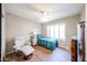 Inviting bedroom featuring a ceiling fan, wood floors and lots of natural light at 4765 E Charleston Ave, Phoenix, AZ 85032
