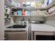 Laundry room featuring a side by side washer and dryer and lots of storage space at 4765 E Charleston Ave, Phoenix, AZ 85032