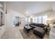 Open-concept living room with stylish decor and lots of natural light at 4765 E Charleston Ave, Phoenix, AZ 85032