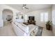 Comfortable living room with tile floors, plantation shutters, and a modern ceiling fan at 4765 E Charleston Ave, Phoenix, AZ 85032