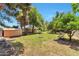 A spacious backyard features a fire pit, swing, shed, and mature trees, creating an inviting outdoor oasis at 504 N Emerson --, Mesa, AZ 85201