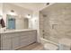 Renovated bathroom with a double vanity, granite countertop, and a shower with modern tiling at 504 N Emerson --, Mesa, AZ 85201