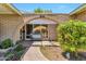 Inviting front porch with a brick archway, a cozy bench, and attractive landscaping at 504 N Emerson --, Mesa, AZ 85201