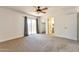 Large, well-lit main bedroom with sliding glass doors and a ceiling fan at 504 N Emerson --, Mesa, AZ 85201