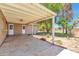 A covered patio creates an outdoor entertainment area with room for dining and lounging on a concrete slab at 504 N Emerson --, Mesa, AZ 85201