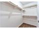 A walk-in closet features shelving and carpet, providing ample space for storage at 504 N Emerson --, Mesa, AZ 85201