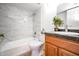 Bathroom features a tub-shower combo with stylish tiling and modern vanity at 5122 E Shea Blvd # 1043, Scottsdale, AZ 85254