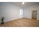 Bright bedroom with light wood floors, white walls, and a ceiling fan at 5122 E Shea Blvd # 1043, Scottsdale, AZ 85254