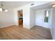 Inviting entryway with light wood floors and white walls leading to the kitchen at 5122 E Shea Blvd # 1043, Scottsdale, AZ 85254