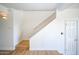 Hallway with wooden stairs and white walls leading upstairs to a bedroom at 5122 E Shea Blvd # 1043, Scottsdale, AZ 85254