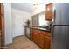 Spacious kitchen features stainless steel appliances, ample cabinet space, and a bright window overlooking a yard at 5122 E Shea Blvd # 1043, Scottsdale, AZ 85254