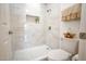 Walk-in shower featuring marble-like tile, a rainfall shower head and a built-in shelf at 5122 E Shea Blvd # 1043, Scottsdale, AZ 85254