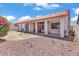 Backyard with covered patio and desert landscaping at 5322 W Wethersfield Dr, Glendale, AZ 85304