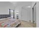 Bedroom with window, modern bed, and bright lighting at 5322 W Wethersfield Dr, Glendale, AZ 85304