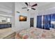 Main bedroom has wood floors, a ceiling fan, and an ensuite bathroom at 5322 W Wethersfield Dr, Glendale, AZ 85304