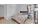 Well-lit bedroom featuring tile floors and large window at 5322 W Wethersfield Dr, Glendale, AZ 85304
