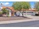 Charming single-story home featuring a clay tile roof, desert landscaping, and a two car garage at 5322 W Wethersfield Dr, Glendale, AZ 85304