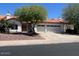 Front exterior featuring a desert landscaped yard, a two car garage and a red-tiled roof at 5322 W Wethersfield Dr, Glendale, AZ 85304