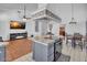 Gourmet kitchen offers breakfast bar seating and stainless steel cooktop at 5322 W Wethersfield Dr, Glendale, AZ 85304