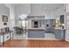 Bright open kitchen with tile floors, grey cabinets and stainless steel appliances at 5322 W Wethersfield Dr, Glendale, AZ 85304