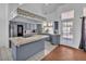 Bright eat-in kitchen features updated cabinets, tile floors and countertops at 5322 W Wethersfield Dr, Glendale, AZ 85304