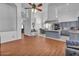 Bright open concept with laminate floors, white walls and an adjacent kitchen at 5322 W Wethersfield Dr, Glendale, AZ 85304