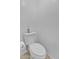 Bathroom with a standard white toilet, tile floors, and white walls at 5322 W Wethersfield Dr, Glendale, AZ 85304