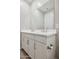 Bathroom vanity featuring double sinks, chrome faucets and plentiful storage at 5859 E Covey Ln, Phoenix, AZ 85054