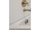 Bathtub fixtures with faucet, drain and tap in brushed bronze at 5859 E Covey Ln, Phoenix, AZ 85054