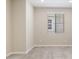 A spacious, carpeted bedroom with neutral-toned walls and natural light at 5859 E Covey Ln, Phoenix, AZ 85054