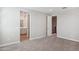 Spacious bedroom with carpet, two doorways, and a view of the upstairs landing at 5859 E Covey Ln, Phoenix, AZ 85054