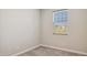 Neutral bedroom features gray carpet, white walls, and window with blinds at 5859 E Covey Ln, Phoenix, AZ 85054