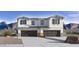 Beautiful two-story home featuring a neutral palette, two-car garage, and mountain views at 5859 E Covey Ln, Phoenix, AZ 85054