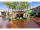 Stylish outdoor fireplace with seating creating a cozy ambiance near retail stores and lush greenery at 5859 E Covey Ln, Phoenix, AZ 85054