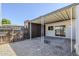 Cozy backyard featuring a covered patio, gravel landscaping, a storage shed and wood fencing at 6601 N 46Th Ln, Glendale, AZ 85301