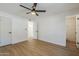 A clean and bright bedroom showcases a neutral color palette and ceiling fan at 6601 N 46Th Ln, Glendale, AZ 85301
