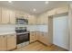 This kitchen offers stainless steel appliances, bright countertops and lots of cabinet space for storage at 6601 N 46Th Ln, Glendale, AZ 85301