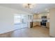 Modern kitchen boasts stainless steel appliances, sleek countertops, and sliding door to the yard at 6601 N 46Th Ln, Glendale, AZ 85301