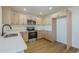 A bright kitchen features stainless appliances, light countertops, modern fixtures, and ample storage at 6601 N 46Th Ln, Glendale, AZ 85301