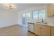 Modern kitchen has stainless steel appliances and a view of the backyard through the kitchen window at 6601 N 46Th Ln, Glendale, AZ 85301