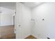 Clean and bright laundry room hookups with view into the rest of the home at 6601 N 46Th Ln, Glendale, AZ 85301