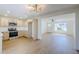 Spacious living space showcases a well-equipped kitchen and front living room with natural light at 6601 N 46Th Ln, Glendale, AZ 85301