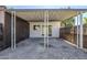View of a covered patio with gravel landscaping and fenced yard at 6601 N 46Th Ln, Glendale, AZ 85301
