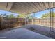Covered patio area with gravel landscaping and a fenced yard at 6601 N 46Th Ln, Glendale, AZ 85301